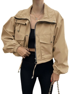Detailed view of khaki utility jacket with zipper, flap pockets and adjustable drawstring hem