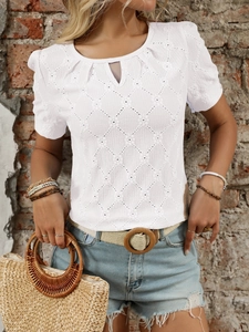Detail of white hollow-out knit top with rhombus texture and chic buttoned crew neck