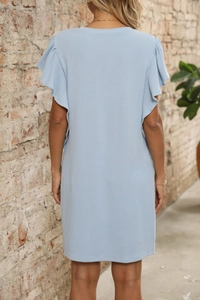 Detail of light blue ruffle sleeves and vertical striped texture on a summer dress