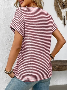 Close-up of red and white striped knit t-shirt with rolled sleeves and texture details
