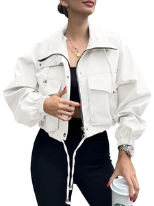 Detail of white cropped jacket featuring utility pockets, zipper closure and elastic cuffs