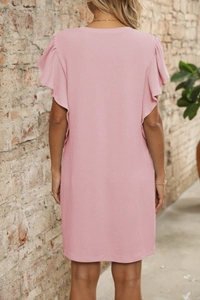 Back view of a pink summer dress with pleated texture and stylish ruffle sleeves