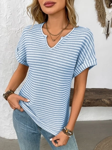 Detail of blue and white striped knit texture and V-neck design on a casual summer T-shirt