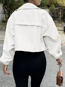 Rear view of white cropped windbreaker jacket with back panel detail and elastic cuffs