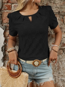 Detail of black short sleeve top featuring hollow diamond texture and droplet neckline