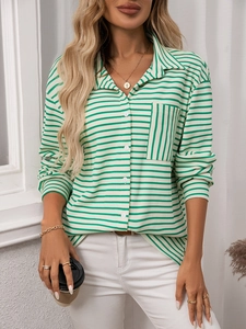 Detailed view of the striped green shirt collar, front pocket, and texture of the fabric
