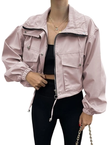 Close-up of pink short utility jacket featuring zipper collar, flap pockets and drawstring hem