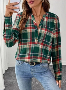 Detailed close-up of a plaid V-neck shirt featuring colorful patterns and button cuffs