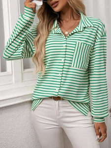Detail showing green striped shirt chest pocket with unique vertical pattern alignment