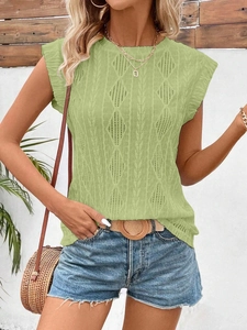 Close-up of light green knit top featuring delicate diamond hollow knit texture