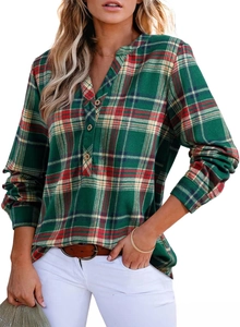Detail of green plaid V-neck shirt featuring button closure and soft textured fabric