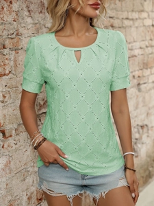 Detail of light green hollow-out knit t-shirt featuring textured diamond grid pattern