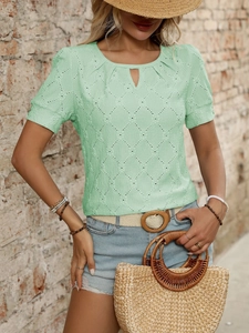 Detail of mint green short sleeve top featuring hollow diamond knit texture and round neck