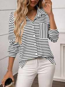 Macro detail of black and white striped shirt fabric with waffle texture and front pocket