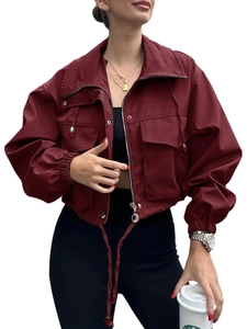 Detail view of wine red cropped jacket with stand collar, zipper, and drawstring hem
