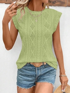 Detail of light green knit top showing diamond texture and ruffle sleeve design