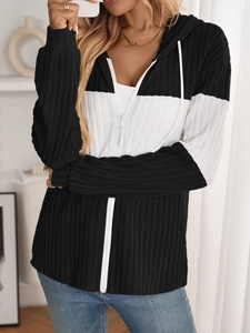 Detail showing high-contrast black and white patchwork fabric with vertical ribbed texture