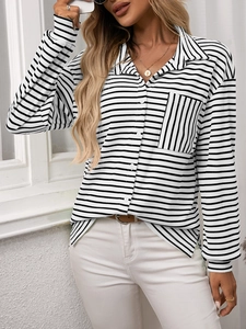 Close-up of women's striped shirt featuring a vertical stripe pocket and buttoned front