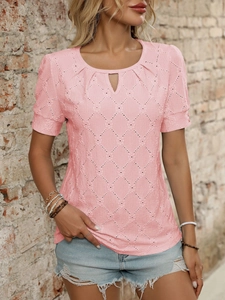 Detail of pink short sleeve top featuring hollow-out eyelets and keyhole neckline