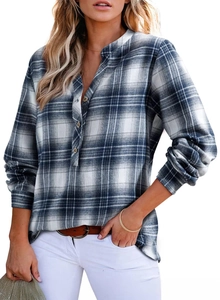 Close-up of classic blue plaid long sleeve shirt with button detail and soft cotton fabric