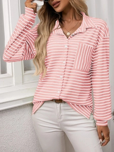 Detail of pink and white striped shirt featuring a vertical stripe contrast chest pocket