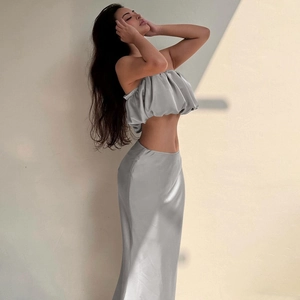 Detail of elegant grey satin two-piece set featuring a cropped tube top and slim skirt