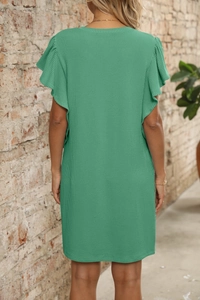 Detail view of grass green midi dress with vertical knit texture and flutter sleeves