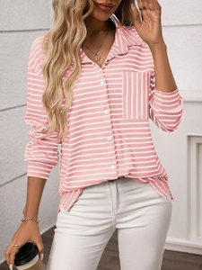 Detailed view of women stripe shirt featuring chest pocket and textured pink fabric