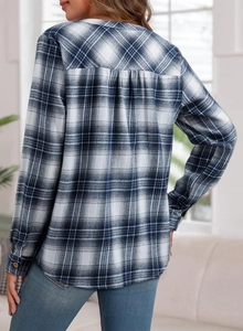 Detail of blue and white plaid shirt with back pleat design for a comfort fit