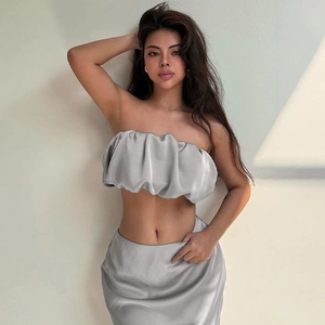 Detailed view of silver grey satin two-piece set with tube top and high waist skirt