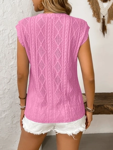 Detailed back view of pink knit sleeveless top showing geometric hollow-out patterns