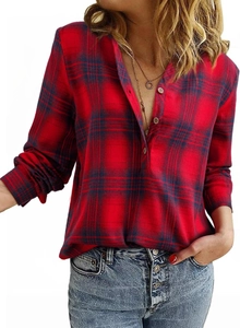 Close-up of red and blue plaid flannel shirt featuring V-neckline and round buttons