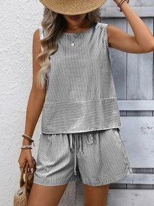 Close-up of black and white striped sleeveless top and matching drawstring shorts