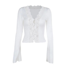 Close-up of white V-neck top featuring delicate lace trim and elegant pearl buttons