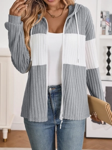 Detailed close-up of the vertical ribbed texture and grey-white contrast knit cardigan