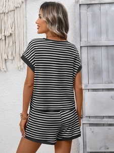 Detailed macro view of black and white striped waffle fabric on women's casual summer set