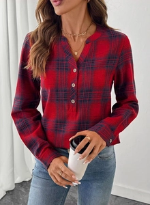Detail of red plaid pattern and V-neckline on a casual long-sleeve women shirt