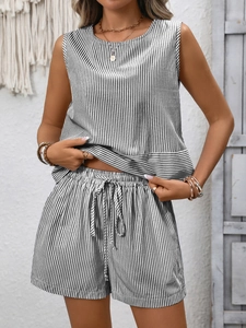 Detail of black and white striped sleeveless top and drawstring shorts summer set