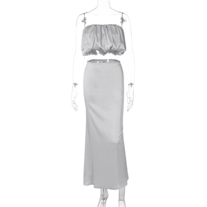 Detailed view of grey satin two-piece set featuring a ruched tube top and long skirt