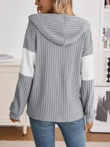 Rear view of casual ribbed knit zip-up hoodie with contrasting white sleeve panels
