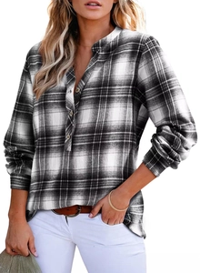 Detail of V-neck plaid shirt featuring classic black and white pattern and button closure