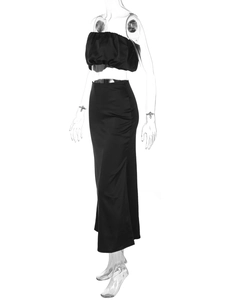 Detail of elegant black satin two-piece set featuring a strapless top and slim maxi skirt
