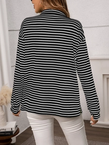 Close-up of black and white striped long sleeve top back view with knit texture