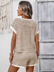 Detail view of summer two-piece striped set with crew neck top and matching shorts