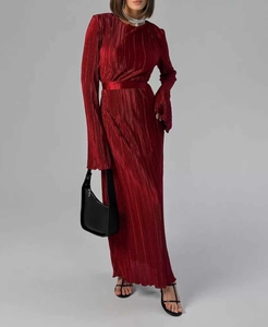 Detail of dark red pleated maxi dress with metallic luster and long sleeves
