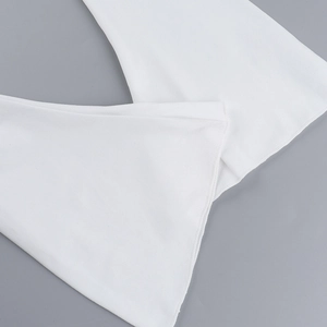 Close-up of white V-neck top showing flared sleeve cuff with neat rolled edge stitching
