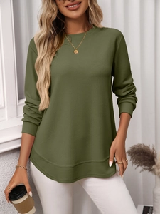 Detailed waffle texture of army green long sleeve shirt with irregular curved hem design