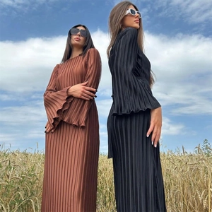 Detailed view of pleated fabric and elegant flare sleeves on these slim fit long dresses