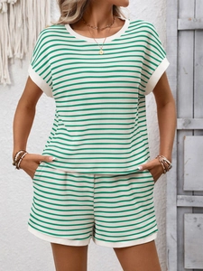 Detailed view of green and white striped knit loungewear set with drawstring shorts