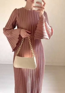 Detailed view of dust pink pleated maxi dress with elegant bell sleeves and high waist